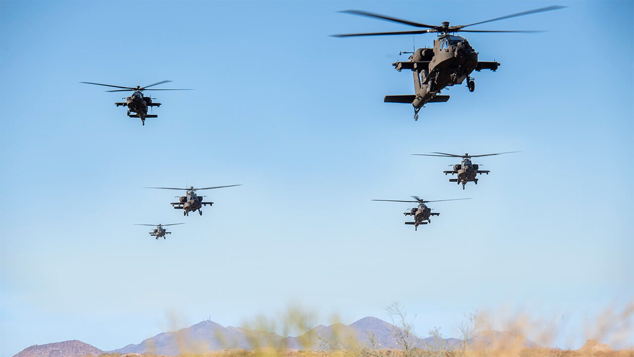 Group of AH-64 Apaches in flight