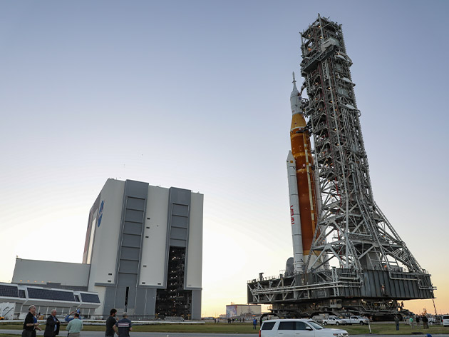 The Artemis I stack, including the orange-colored Space Launch System rocket, rolls out to Launch Complex 39B on Thursday, March 17.