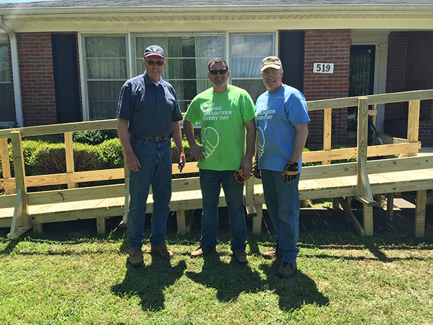   Shanahan (right) and fellow Boeing volunteers Jim Leary (center) and Terry Tipton (left) work a Habitat for Humanity project in Huntsville.