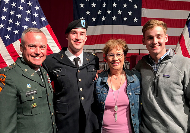   Shanahan (left) with his son Patrick (center-left), wife Mindy (center-right) and son Kevin (right) at Patrick’s college graduation from Norwich University in 2018.