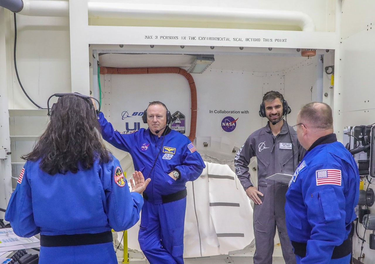 Garrett Pinder with the Starliner Pad team during a Mission Dress Rehearsal with NASA astronauts Suni Williams, Butch Wilmore and Mike Fincke.