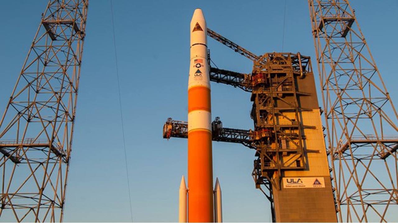 ULA rocket on launch page surrounded by towers