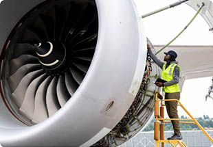 Image of man inspecting plane