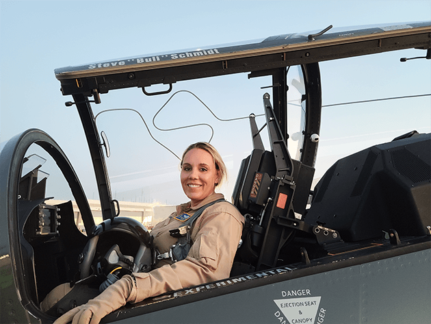 Caroline Jensen in the cockpit of a jet