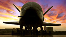 Wallpaper picture of X-37B at sunset.